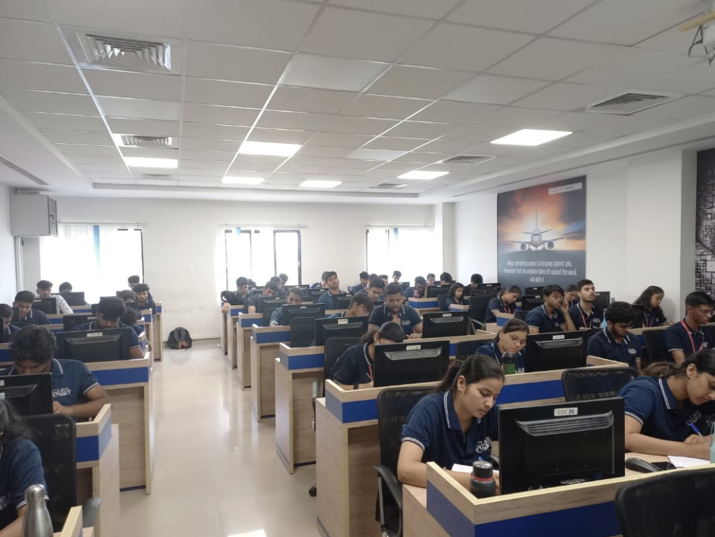 Students actively engaged in hands-on CAD & 3D printing software training at NMIT computer lab.